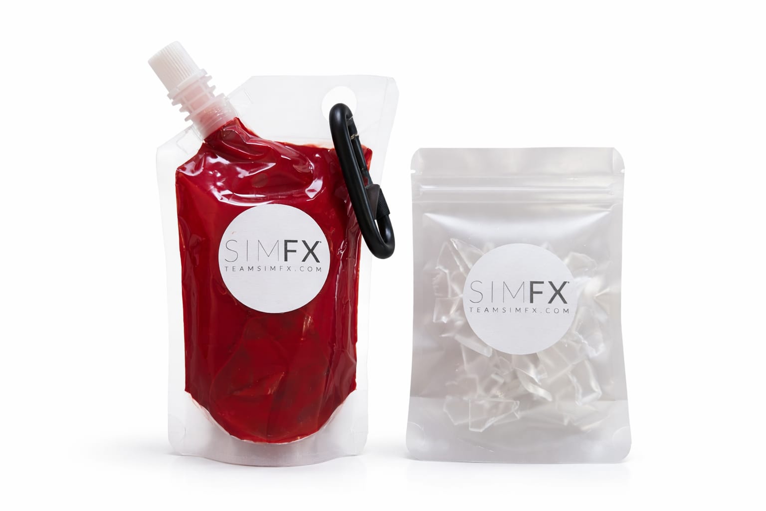 A SIMFX simulated blood pouch with a carabiner clip, beside a sealed pack of resin glass shards