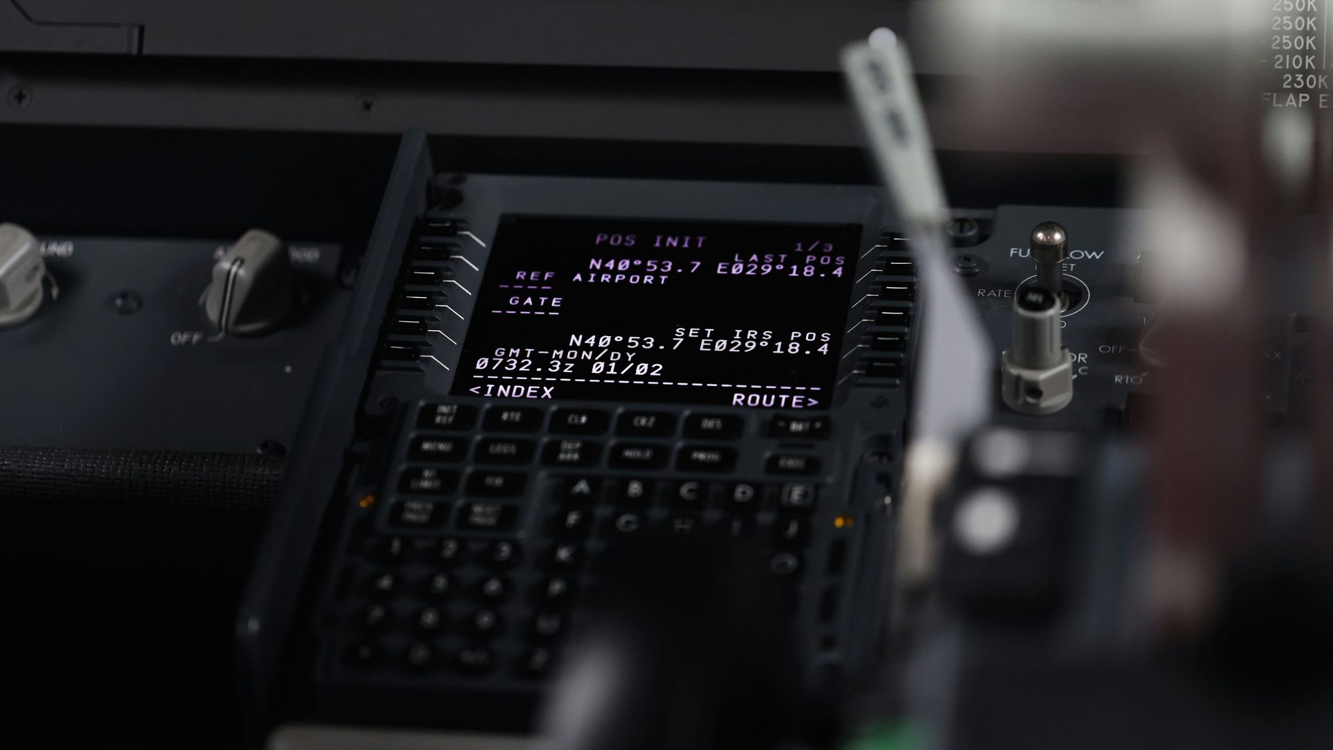 A flight deck control display unit on its position initialisation page